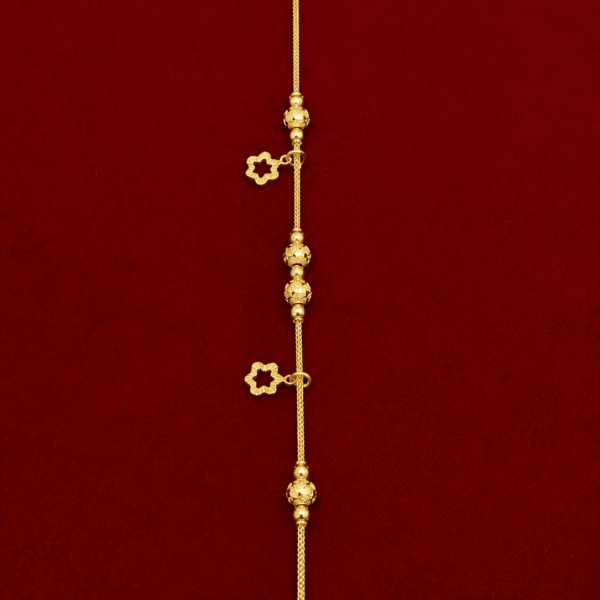 18K yellow gold floral station bracelet.